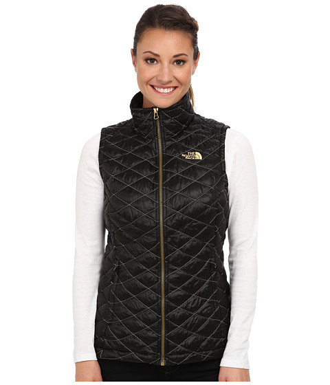 black and gold north face vest